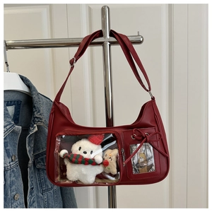 Red leather ita bag featuring a clear window with a cute white plush bear and bow charms