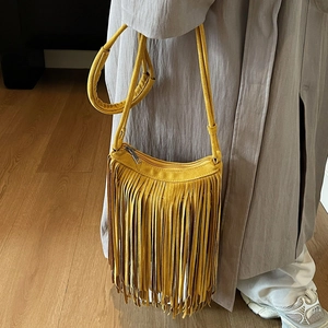 Vintage yellow faux suede woven crossbody bag with long bohemian tassel fringe and zip closure