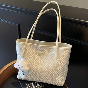 Ethnic style white tote bag with geometric patterns and plush cloud charm accessory