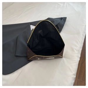 Brown envelope clutch interior view with geometric pattern and gold metal accents