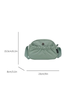 Mint green pleated crossbody bag with woven strap and dimensions 23x15.5x8cm
