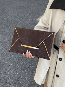 Brown snakeskin envelope clutch with gold metal trim and buckle for women in 2025 style