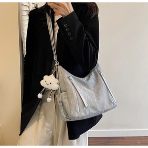 Quilted gray shoulder bag with metallic zipper and white cloud plush charm detail