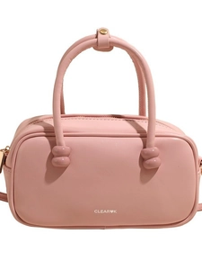 Pink designer crossbody handbag with top handles and gold ball metal hardware