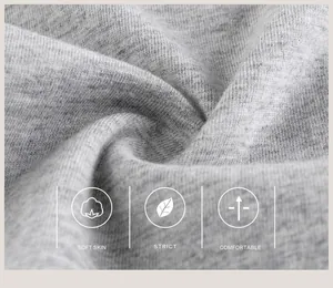 Gros plan sur le tissu en coton gris doux et respirant pour t-shirts enfant de qualité