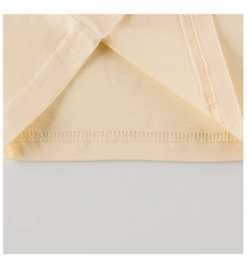 Detailed macro view of the double-needle hem stitching on a cotton baby t-shirt