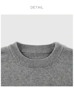 Close-up of the ribbed crew neck detail on this grey knitted children sweater