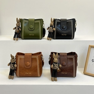 Vintage Women's PU Leather Bucket Crossbody Bag Ethnic Style Wide Strap Shoulder Bag With Bunny Charm Rivet Detail Messenger Bag