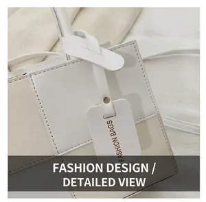 Close-up of litchi texture grain and contrast stitching on a stylish crossbody bag