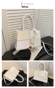 Detail of color-block PU leather square bag showing front, top and side views
