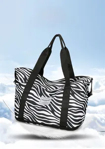 Close-up of zebra pattern travel bag with water-resistant fabric and lightweight feel