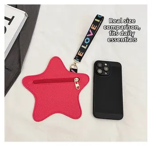 Star-shaped red mini bag size comparison next to a smartphone showing compact storage space