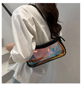 Iridescent laser PVC shoulder bag with black trim shown on model standing on stairs