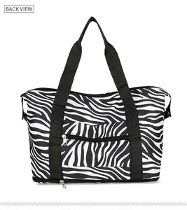 Vue arrière du grand sac de voyage zébré avec doubles poignées et compartiments zippés