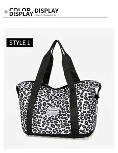 Detail of cow print oxford bag featuring bottom shoe compartment and brand label