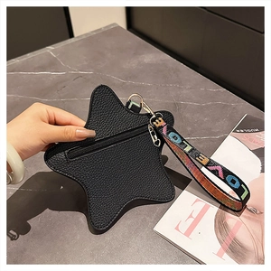 Star-shaped coin purse with black lychee grain texture and a colorful LOVE strap handle