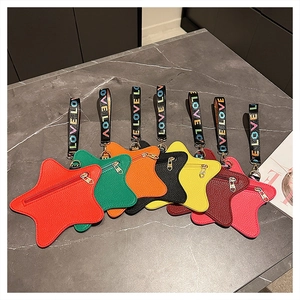 Flat lay of star-shaped mini bags in various colors with Love Love wrist straps