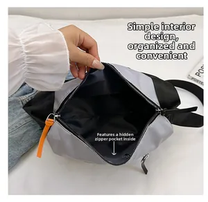 Detail view of the spacious inner compartment with a secure zipper pocket for storage