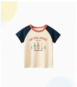 Close-up of kids raglan short sleeve T-shirt with cartoon duck print and red collar