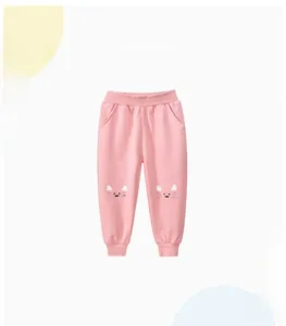 Detail of pink girls' joggers featuring cat face print, elastic waist and ribbed cuffs