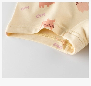 Detail of girls' cotton underwear showing neat stitching and cute cat fishbone patterns