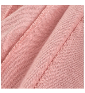 Macro shot of pink fabric texture with high-quality double stitching detail