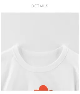 Détail du col rond en maille côtelée d'un t-shirt blanc pour enfant en coton