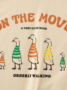 Beige kids cotton T-shirt featuring cute cartoon ducks print with On The Move text