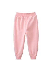 Pink cotton jogger pants for girls with elastic waist and ribbed cuffs on white background