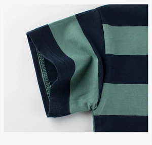 Detail of navy and green striped kids knit t-shirt sleeve showing premium stitching texture