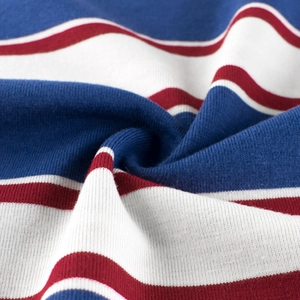 Macro detail of red, white and blue striped cotton knit fabric showing soft texture