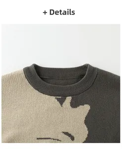 Detail of the ribbed crew neck and two-tone knit texture on child's cartoon sweater