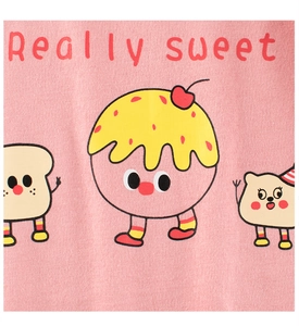 Detail of pink knit shirt showing cute cartoon food characters and Really sweet text