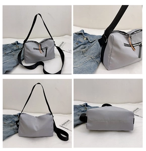 Detailed views of light grey nylon crossbody bag with orange zipper pull and wide black strap
