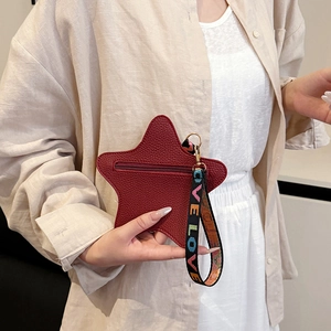 Star shaped burgundy crossbody mini bag with textured leather and LOVE embroidered strap