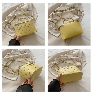Detailed four-way view of yellow quilted mini box bag with rivets and camellia charm