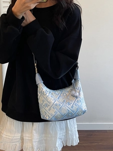 Elegant Chinese style crossbody bag with blue embroidery pattern and beaded tassel