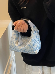 Blue and white floral jacquard handbag with oriental hobo style and metal buckle detail