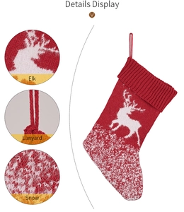 Detail view of red knitted Christmas stocking featuring elk and snowflake patterns with lanyard