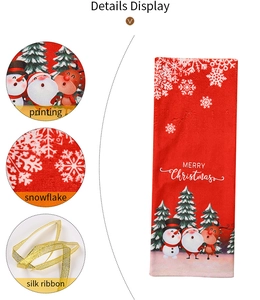 Detail view of red Christmas wine bottle bag with festive Santa and snowman prints