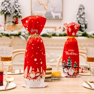 Red Christmas wine bottle covers featuring Santa and Snowman prints with gold ribbons