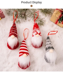 Detailed view of four Christmas gnome ornaments with various knitted hat patterns
