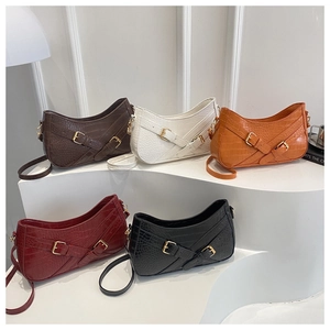 Detail view of crocodile texture hobo bags with metallic buckle and adjustable straps