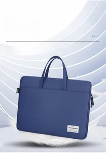 Close-up of waterproof blue laptop bag featuring durable handles and smooth double zippers
