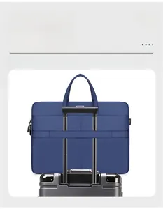 Blue business laptop bag featuring a back luggage strap for easy travel attachment