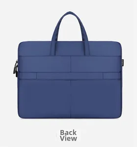 Detail view of navy laptop bag featuring a back strap for luggage handle attachment