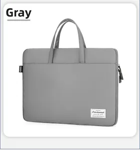 Detail of gray nylon laptop bag showing sturdy handles and a fashion brand label