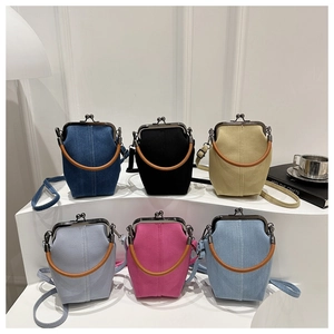 Multi-color display of vintage denim doctor-style mini crossbody bags with metal clasp