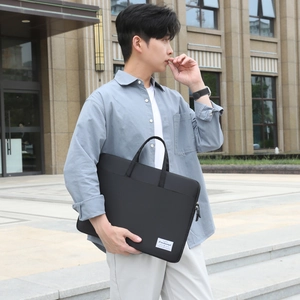 Modern black laptop briefcase with shoulder strap for business commute and office use