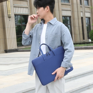 Minimalist navy blue laptop briefcase featuring dual handles and premium fabric for business